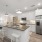 Chef style kitchen with stainless steel appliances and large island