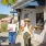 women holding drinks in front of a local eatery