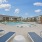lounge chairs surrounding swimming pool