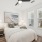 Bedroom with bed and nightstand with large windows